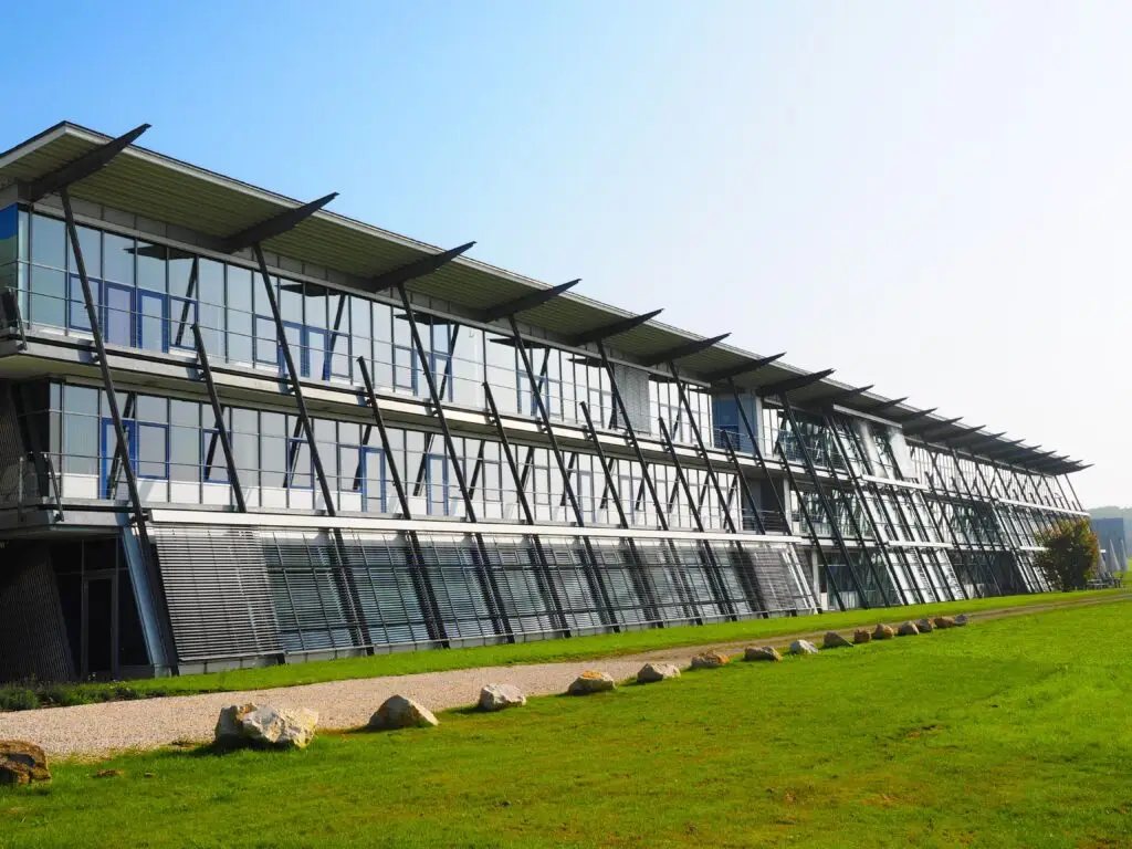 Commercial glass canopy and exterior structural window framing treated with protective film.